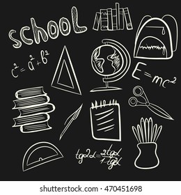 Set of school supplies on a black background