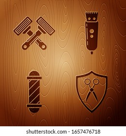 Set Scissors hairdresser and shield, Crossed shaving razor, Classic Barber shop pole and Electrical hair clipper or shaver on wooden background. Vector