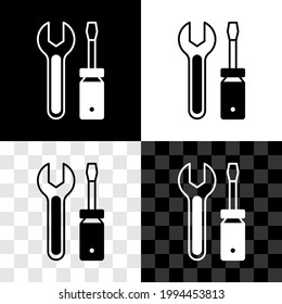 Set Screwdriver and wrench spanner tools icon isolated on black and white, transparent background. Service tool symbol.  Vector