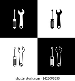 Set Screwdriver and wrench tools icon isolated on black and white background. Service tool symbol.  Vector Illustration