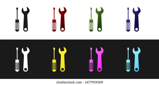 Set Screwdriver and wrench tools icon isolated on black and white background. Service tool symbol.  Vector Illustration
