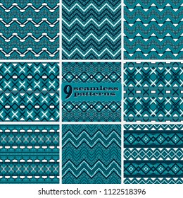 Set of seamless abstract geometric patterns with complex zigzag. Dark blue and white colors. Fashion vector backgrounds collection