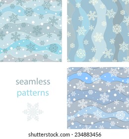 Set of seamless background with snowflakes and snowballs and winding wavy lines on a blue background