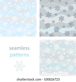 Set of seamless background with snowflakes and snowballs and winding wavy lines on a blue pastel background
