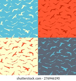 Set of seamless birds patterns. Vector duotone seagulls backgrounds.