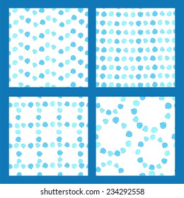 Set of seamless patterns with artistic watercolor blue dots. Simple vector background.