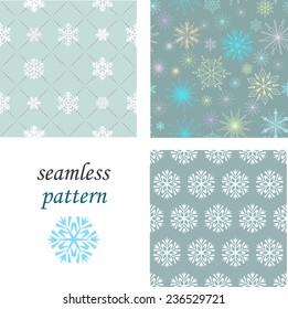 Set of seamless patterns of crystal snowflakes on a pastel blue background