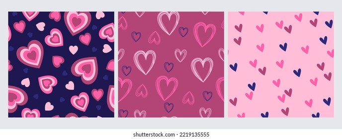 Set of seamless patterns with hearts in blue and pink colors. Vector graphics.