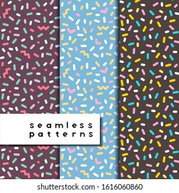 Set of seamless patterns with particles: dots, zig-zags, rounded stick, hearts, doves and flowers. Vintage colors. Repeatable. Stock pattern for backdrop use, wrapping paper, textile design. 