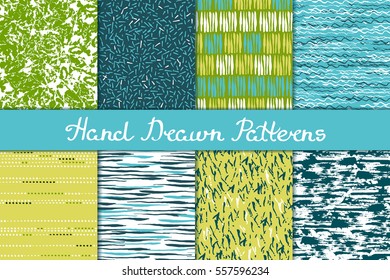 Set of seamless patterns in white, green, blue and yellow. Ink and brush. Hand drawn. Vector illustration.