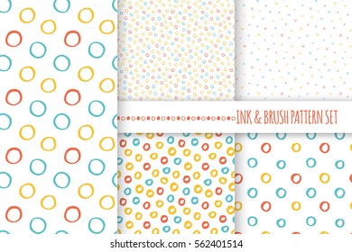 Set of seamless vector free hand multicolored baby doodle polka dot and circle textures, dry brush ink art.