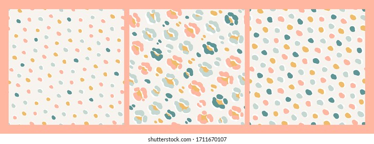 Set of seamless vector patterns. Abstract hand-drawn organic shapes, animal skin pattern, leopard, jaguar print. Collection of square designs in pastel blue, pink and yellow on a neutral background.