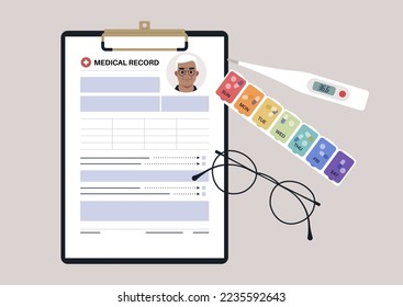 A set of senior patient's medical chart clipped to a clipboard, pill box, glass frames, and plastic thermometer