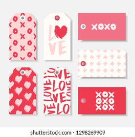 A set of seven cute romantic gift tag templates in red, pastel pink and white. Valentine's day/ wedding favors, birthday present label vector designs.