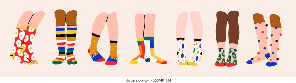 Set of seven pairs of female or male legs in the socks. Cool various prints. Stylish underwear. Fashion accessories. Footwear. Hand drawn vector colored trendy illustration. Flat design