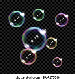 Set of several translucent colored soap bubbles on transparent background. Transparency only in vector format