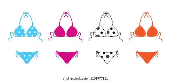 Set of shapely polka dotted bikini bathing suits.Two-piece swimsuits colored set isolated on white background. Vector illustration. 