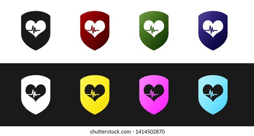 Set Shield and heart rate icon isolated on black and white background. Health protection concept. Health care. Vector Illustration