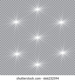 Set of shining lights isolated on a transparent background. The flash flashes with rays and a searchlight. Light effect of glow. The star flashed with sparkles.