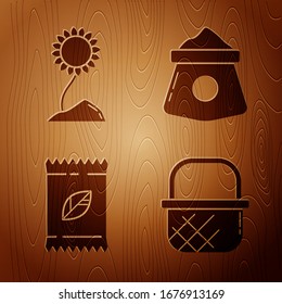 Set Shopping basket, Sunflower, A pack full of seeds of a specific plant and Bag of flour on wooden background. Vector