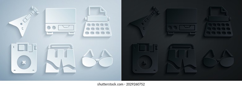 Set Short or pants, Retro typewriter, Floppy disk, Glasses, Old video cassette player and Electric bass guitar icon. Vector