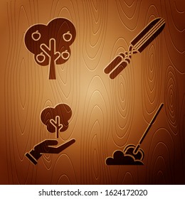 Set Shovel in the ground, Tree with apple, Tree in hand of environmental protection and Gardening handmade scissors for trimming on wooden background. Vector