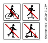 A set of signs prohibiting roller skating, scooters, bicycles and skateboards.