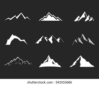 Set of silhouette mountain . Outdoor icons. Hand drawn snow ice tops, decorative symbols isolated. Use them for camping logo, travel labels, climbing or hiking badges. Vector.