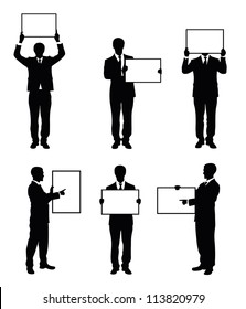 Set of silhouettes of a businessman holding a board.