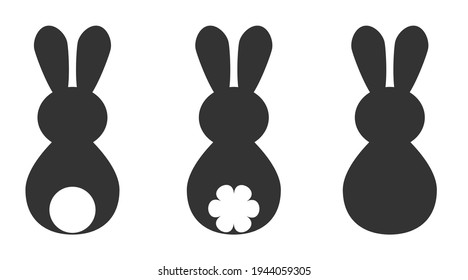Set of silhouettes of Easter bunny vector illustration. Easter bunny back or back with fluffy tail isolated on white background