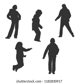 Set of silhouettes of exercising jumping children. Autumn.