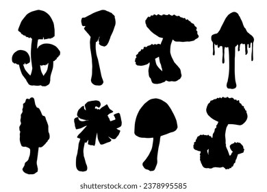 Set of silhouettes of forest mushrooms toadstools. Vector graphics.