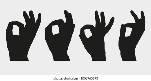 Set of silhouettes of hands showing symbol OK, All right or Very good. Vector illustration.