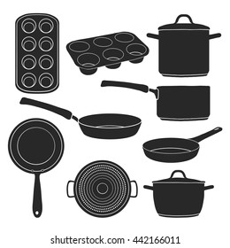 A set of silhouettes of kitchen utensils. Black silhouettes of pots, pans, baking molds. Utensils for cooking.  Baking tools. Silhouettes kitchenware. Vector.