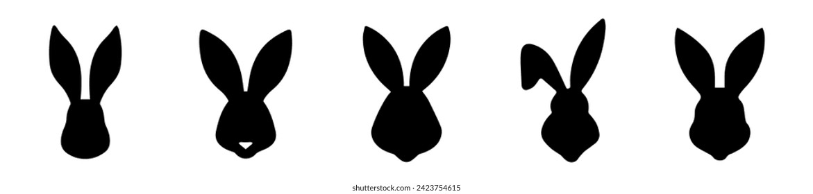 Set of silhouettes of rabbit heads. Easter Bunnies. Isolated on white background. A simple black icons of hares. Cute animals. Ideal for logo, emblem, pictogram, print, design element for greeting
