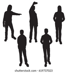 Set of silhouettes of teenagers standing in different poses, sending a message, raising his hand, thrusting his hands in his pockets, black color, isolated on white background