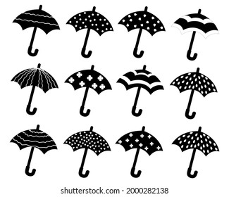 A set of silhouettes of umbrellas with different patterns. Vector isolated on a white background.