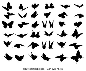 A set of silhouettes of various flying butterflies