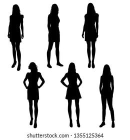 Set of silhouettes  woman standing, slim young women with long legs wearing summer dresses and high heels, vector,  black color, isolated on white background