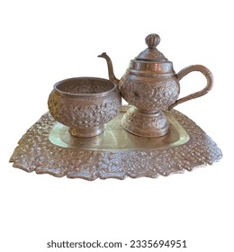 A set of silver jugs and silver bowls on a carved silver tray.