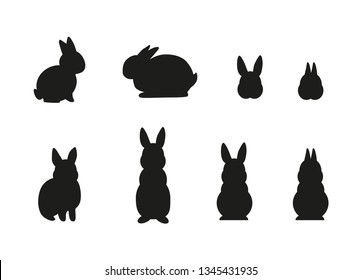 Set of simple black different rabbit silhouettes isolated on white background. - Vector