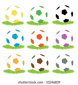 A set of simple coloured soccer ball icons on patches of grass