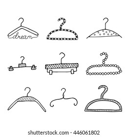 Set of simple hand drawn doodle of a clothes hangers. Vector illustration.