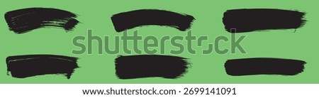 A set of six black brush strokes on a green background, each with a unique shape and texture, creating a dynamic and artistic composition for various design applications