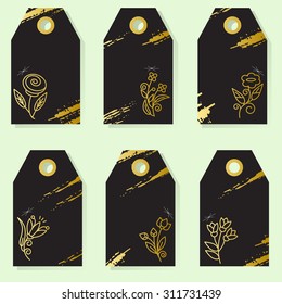 Set of six elegant labels with gold flower and abstract lines on a black background. Buying, selling, advertising, price lists and product label templates.