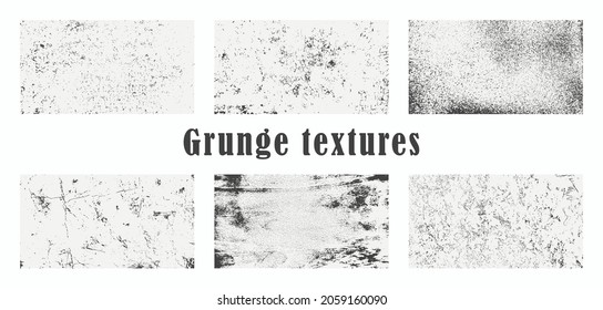 A set of six grunge textures. Black scuffs on a white background. Vector illustration.
