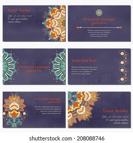 Set of six horizontal business cards.  Beautiful floral oriental pattern in vintage style. Wet watercolor background. Hand drawing.Place for your text. Complied with the standard sizes.