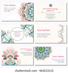 Set of six horizontal business cards. Beautiful floral pattern with oriental traditional flower. Strokes and wood ornament on backdrop. Place for your text.