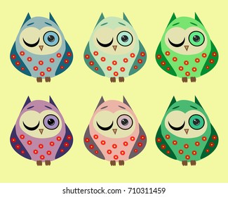 A set of six lovely owls in different color variations in a red flower with one open and one squinted, closed eye