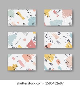 Conjunto de seis tarjetas de negocio vectoriales con ornamento abstracto de pinceles